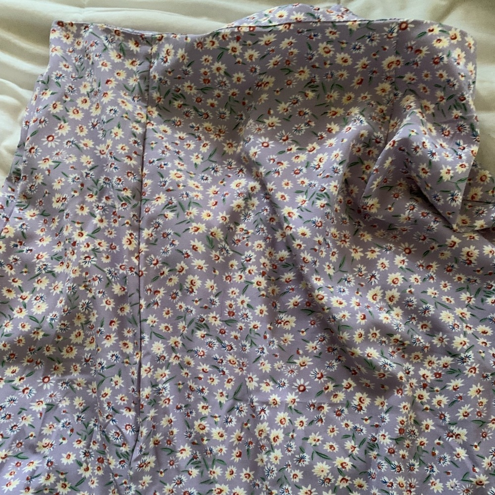 Purple floral maxi skirt with a slit.